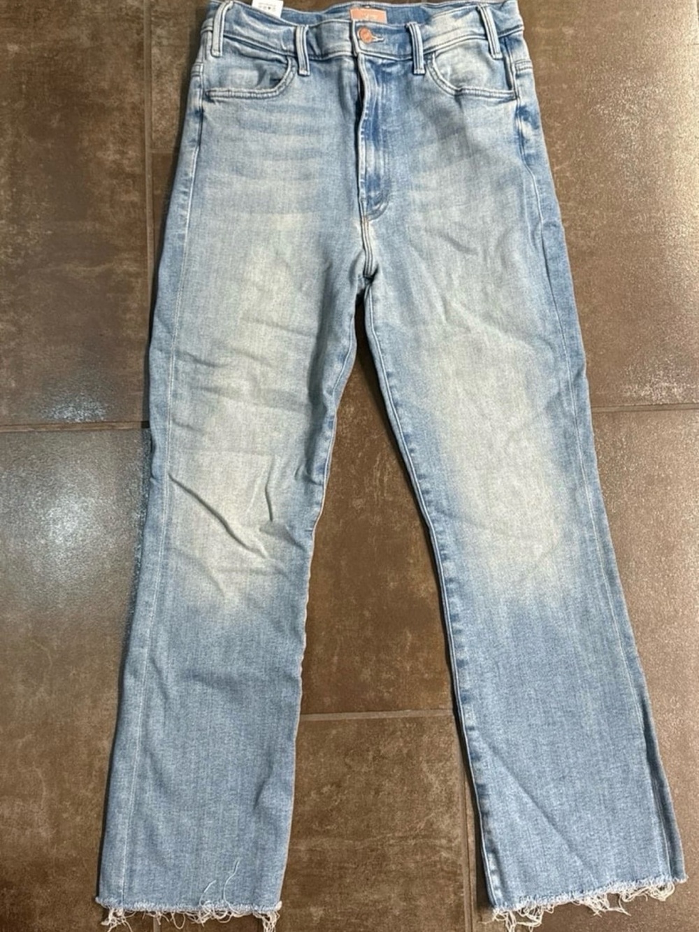 MOTHER Light Wash Flare Jeans with Raw Frayed Hem